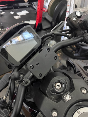 The 3d printed clamp is now substantially blockier. There are two horizontal cutouts in the front of it that hold hex nuts