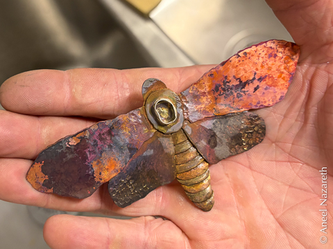 A silver bezel for a cabochon stone setting has been soldered to the center