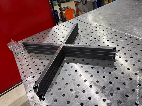 Four stacked X shapes made of tube