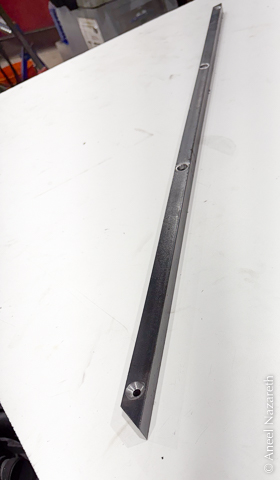 A mitered bar with countersunk holes